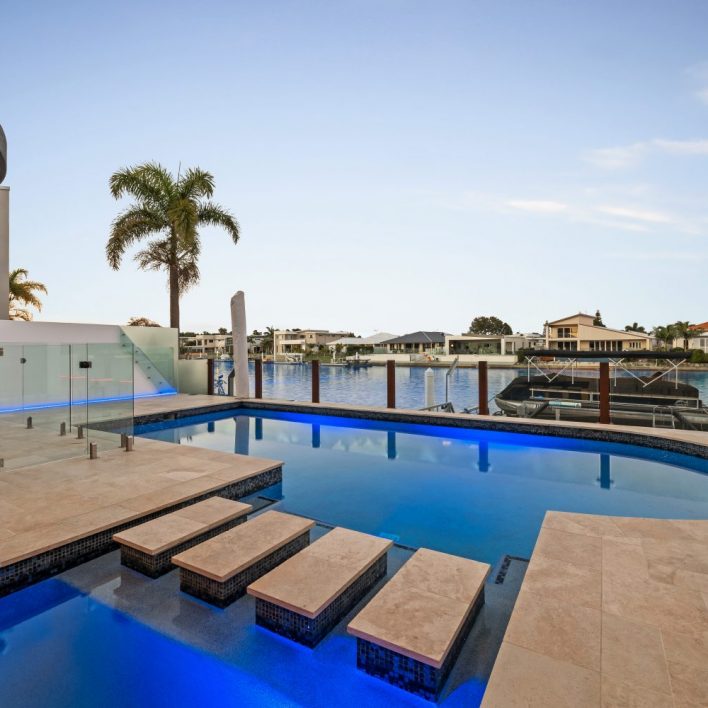 luxury swimming pool and stepping stone Pelican waters